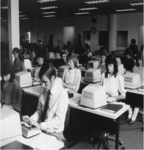 Historic photo of workers at TDEC, a HUBZone small business, providing business process services at Oakland MD location